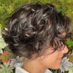 “Curly bixie haircut on natural texture at Avalon Salons”